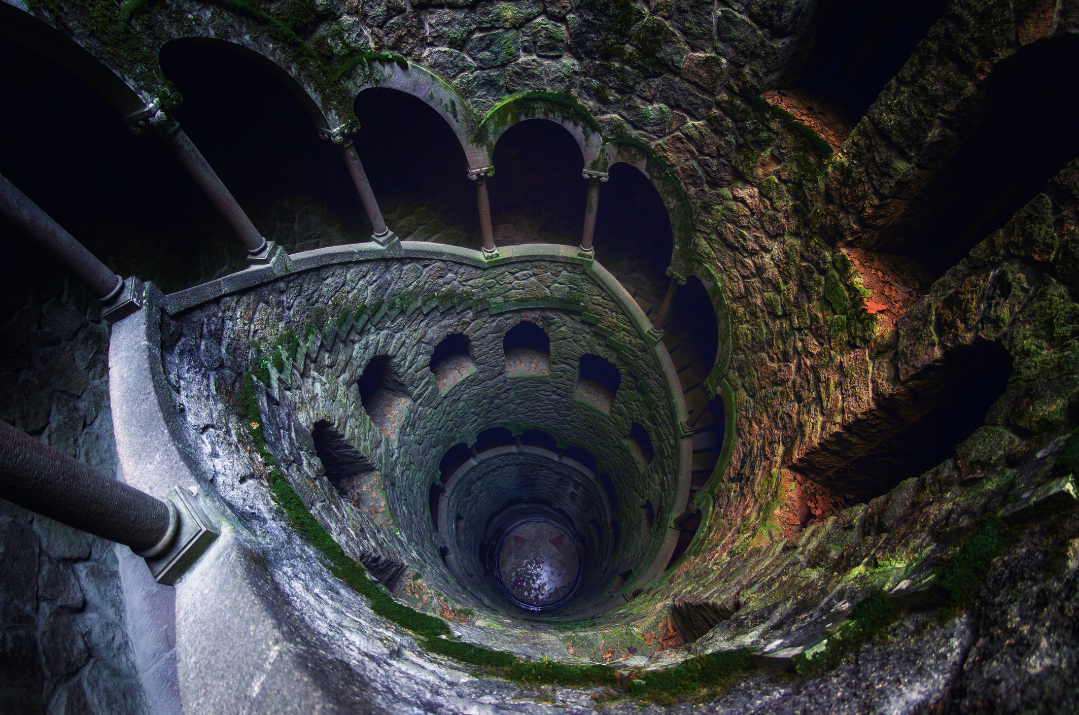 The famous initiation well of the Quinta da Regaleira, masonic spiral staircase of the romantic age in Sintra, Portugal, on February 5, 2019
